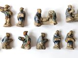 many figurines of different sizes and shapes on the table