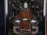 painting of a woman sitting on a throne with a bird in the background