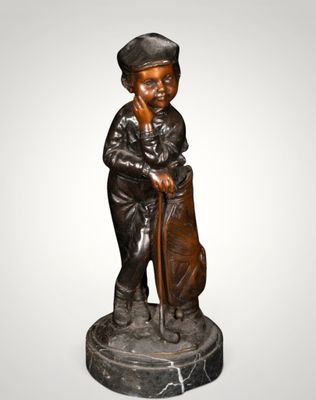 an image of a statue of a boy with a hat and cane