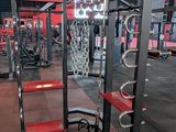 a gym with a lot of equipment in the room