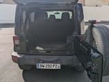 a black van with its door open in a parking lot
