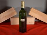 a bottle of wine that is sitting on a table