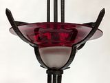 a red and white glass hanging light fixture on a white wall