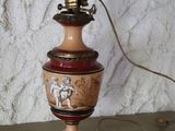 a lamp that is on a table with a lamp shade on it