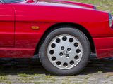 a red sports car parked on the side of the road