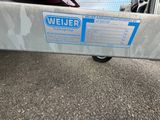 a sign on the back of a trailer that says welder