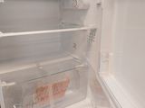 an open refrigerator with a lot of food inside of it