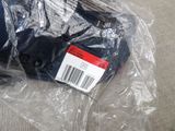 a plastic bag that has a pair of shoes in it
