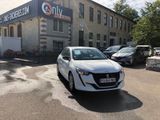 a white car parked in front of a building in a parking lot