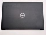 the dell laptop is sitting on a table with a white background