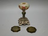 three pieces of silver and a vase on a table