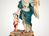 an image of a statue of an angel holding a child