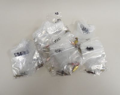 a pile of plastic bags with various types of screws