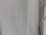 a close up of a white shirt with a black tie
