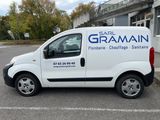 a white van that is parked in a parking lot