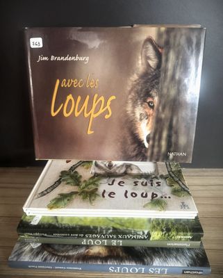 three books stacked on top of each other on a table