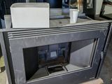 a stove in the middle of a room that is being built