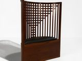 an image of a wooden chair with a black seat on a white surface