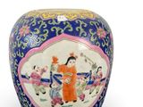 a blue vase with a picture of a woman on it
