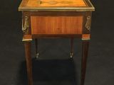 an image of a small wooden table with a drawer on it