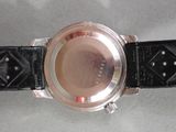 a close up of a watch on a table