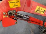 a close up of a red machine with a sign on it