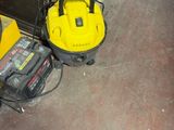 two tools that are sitting on the floor next to each other
