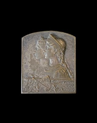 an image of a bronze plaque depicting a woman and a man