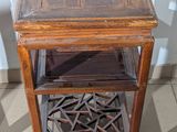 a small wooden table with a drawer underneath it