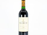 a bottle of wine that is sitting on a table
