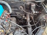 a car engine with a blue cover on top of it