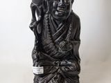 a statue of a man holding a bird in his hand