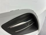 a close up of a car ' s front bumper