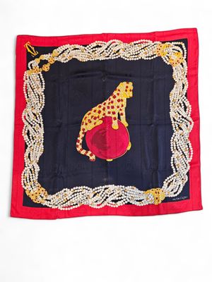 an image of a giraffe scarf hanging on a wall