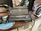 a laptop computer sitting on top of a desk with a mouse