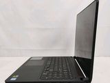 an open laptop computer sitting on top of a white table