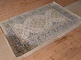 a rug on the floor in the middle of the room