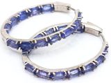 pair of tanzanite hoop earrings on a white background