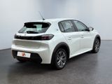 the rear end of a white car parked in a room