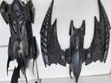 two black bats that are hanging on the wall