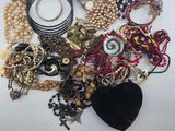 many different types of jewelry on the table