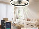 an image of a living room with a ceiling fan and remote control