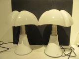 two lamps that are sitting on a table