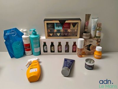 many different types of skin care products displayed on a table