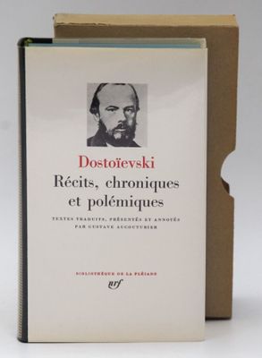 the book is sitting on the table next to the box