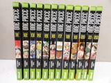 six vhss of various anime movies are lined up on a table