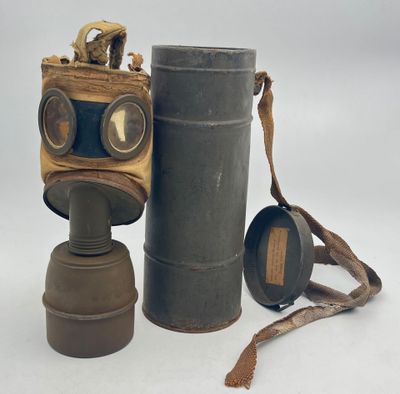 a gas mask and a pair of binoculars on a white background