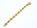 a close up of a gold chain bracelet on a white background