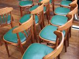 a lot of chairs that are sitting on a wooden floor