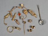 a lot of gold and silver jewelry on a table